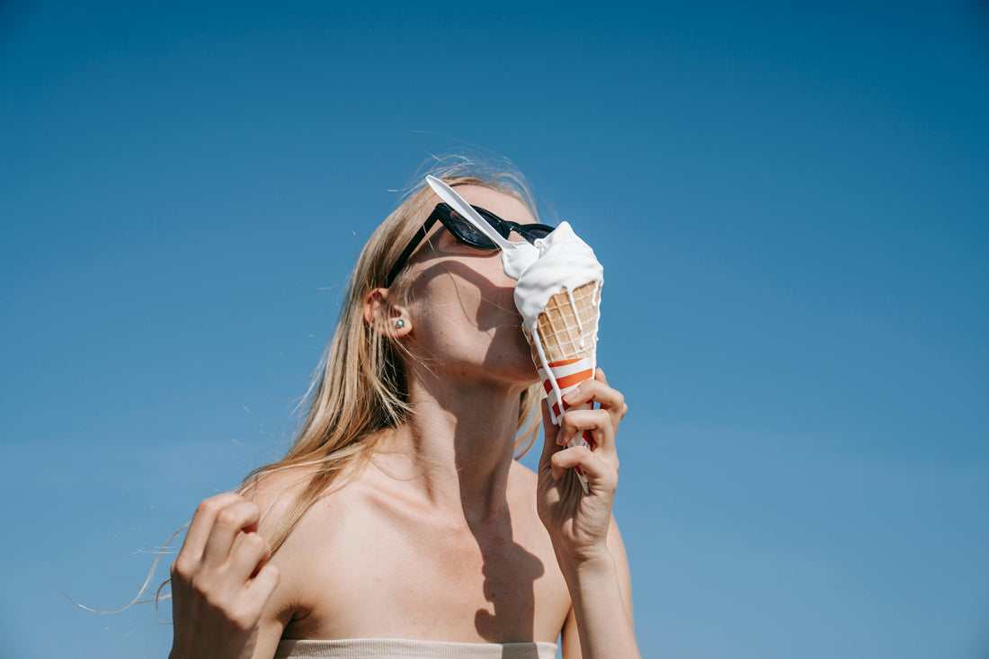 beautiful women with sunglasses eating icecream