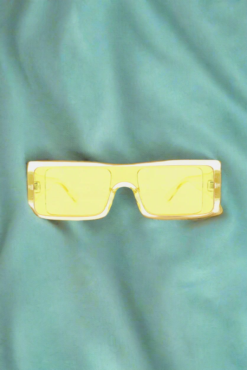 Supanova rectangle sunglasses with polycarbonate frame and wide lenses, radiating bold energy and sleek attitude on a minimalist display.