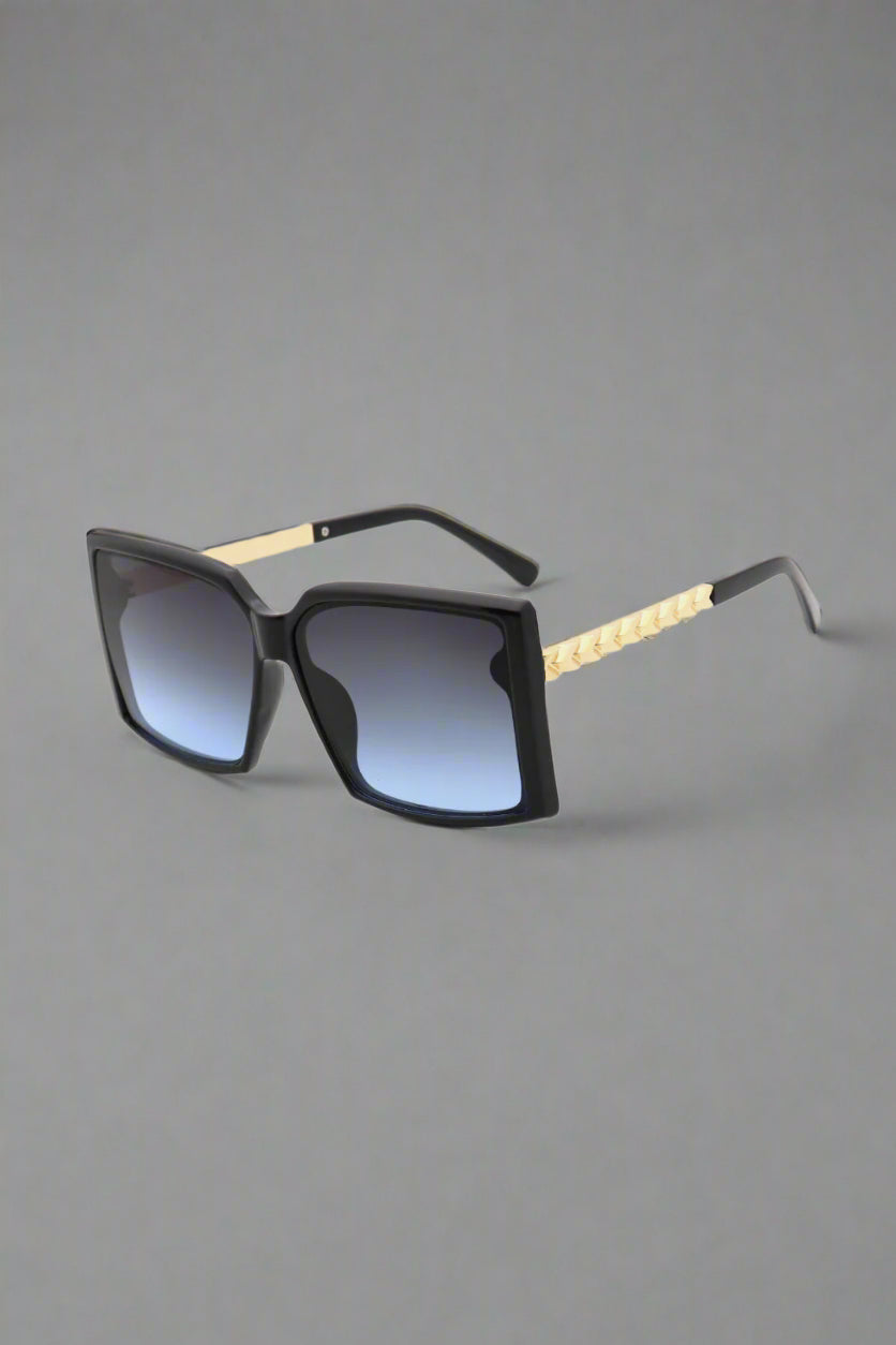 Vespa sunglasses featuring a vintage-inspired aviator shape, shimmering under golden hour light — radiating retro charm and effortless cool.