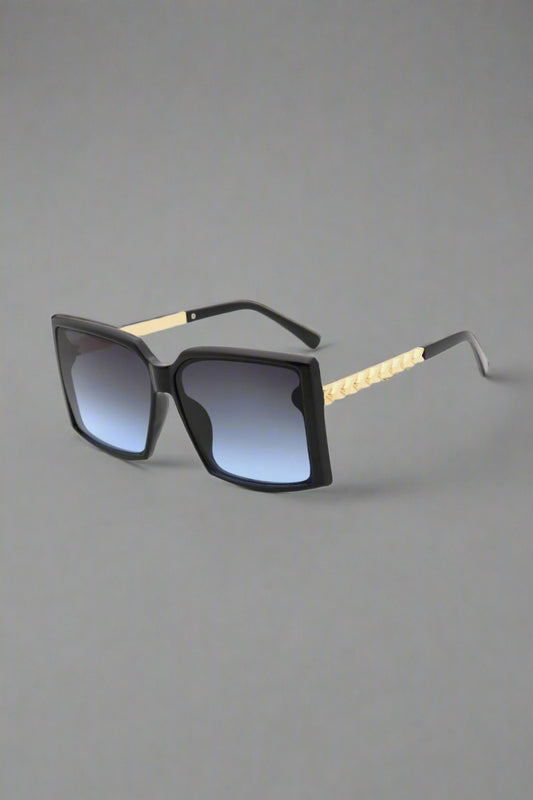 Vespa sunglasses featuring a vintage-inspired aviator shape, shimmering under golden hour light — radiating retro charm and effortless cool.